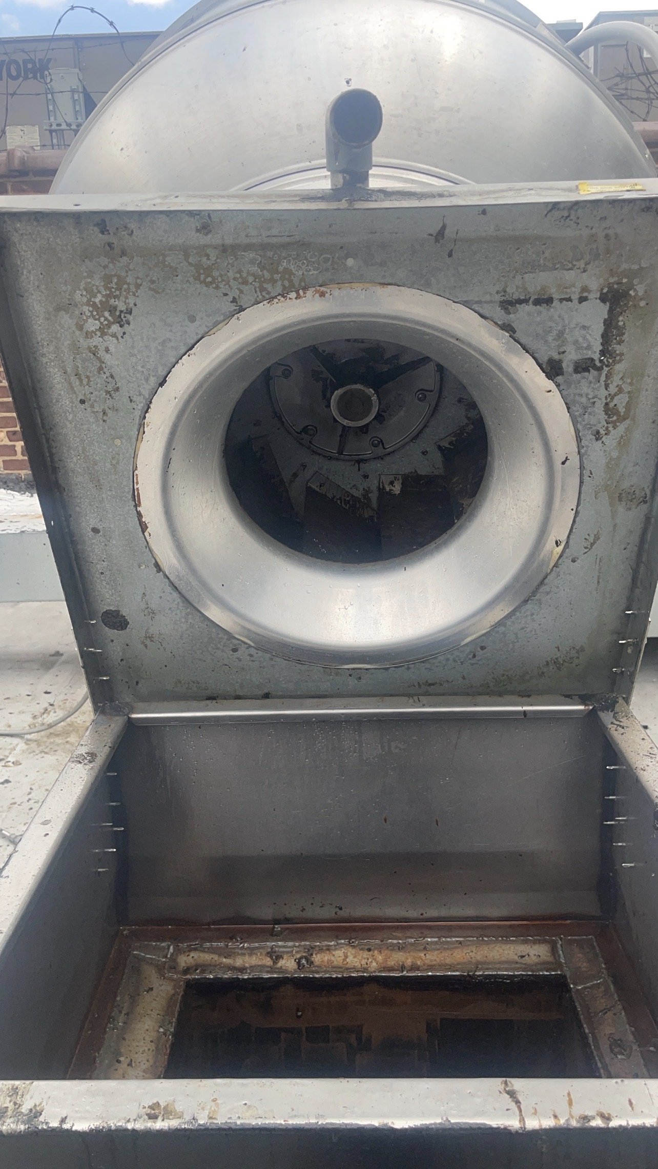 Commercial rooftop exhaust fan after professional cleaning