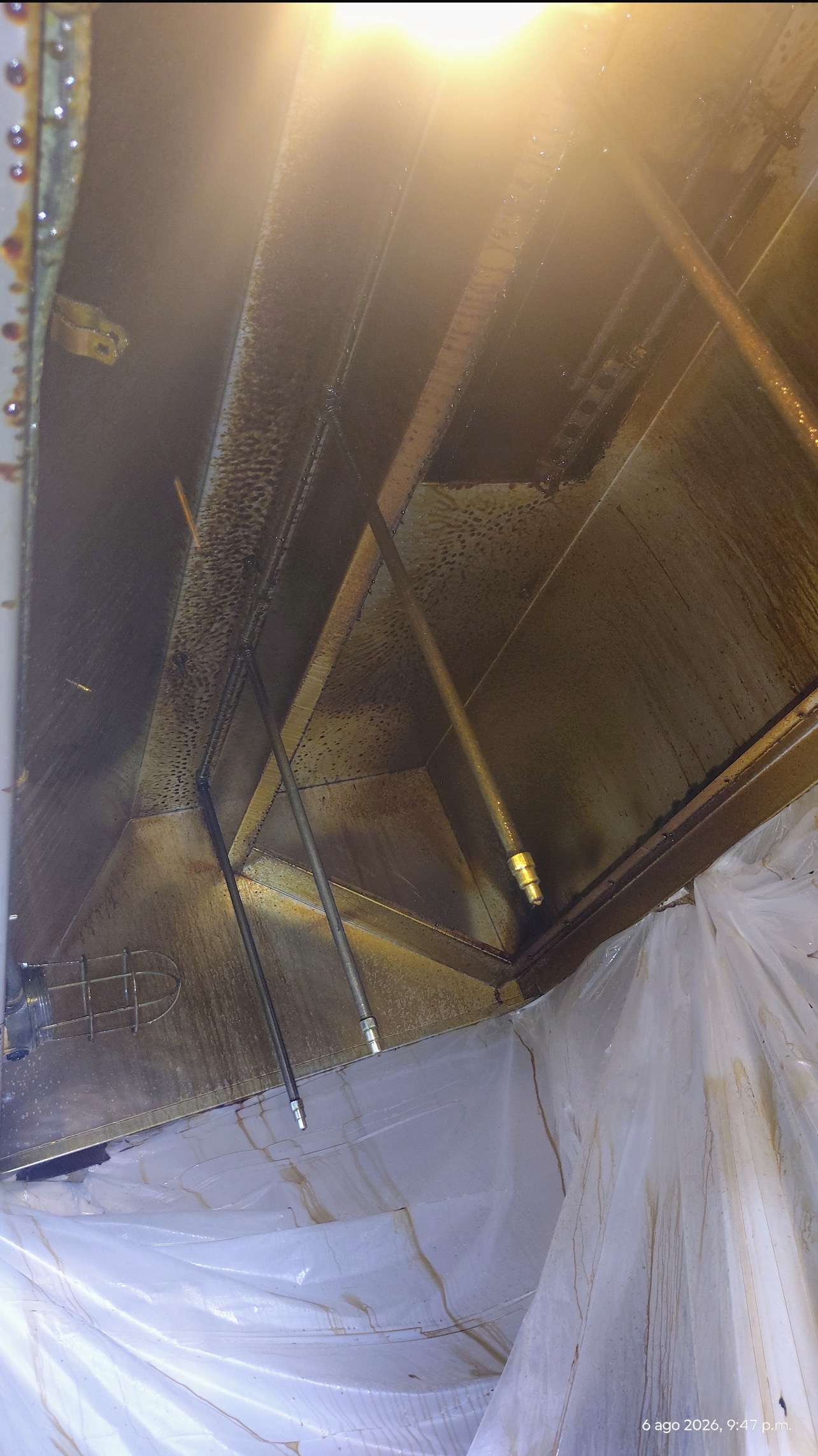 Grease buildup inside commercial kitchen exhaust hood before cleaning